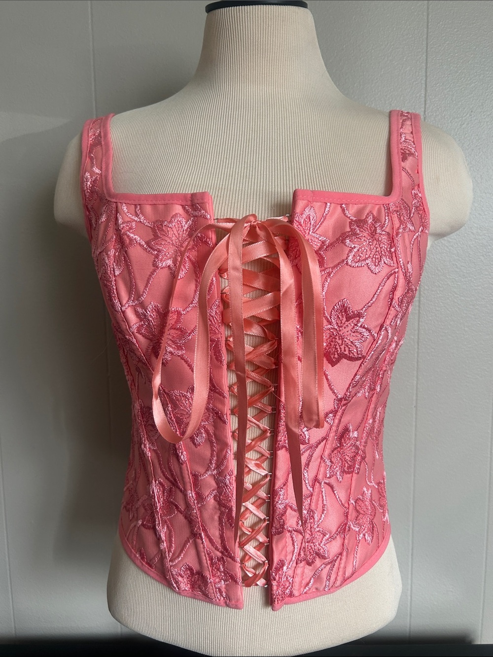 Lovely pink bustier styled corset with floral embroidery